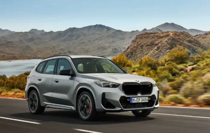 2026 BMW X1 M35i compact SUV in metallic blue showcasing front grille and sporty design